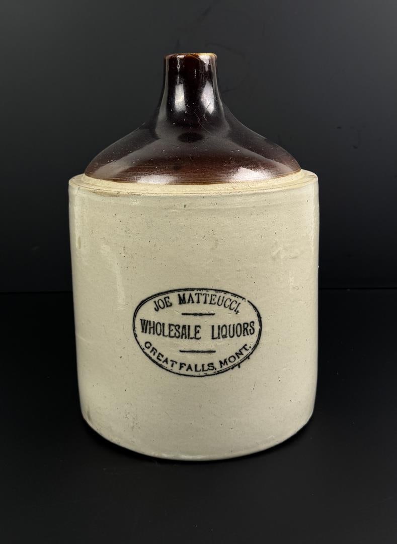 Joe Matteucci Liquors Great Falls Montana Jug: Made by Red Wing. 13" tall, 9" diameter. Light damage present as shown.