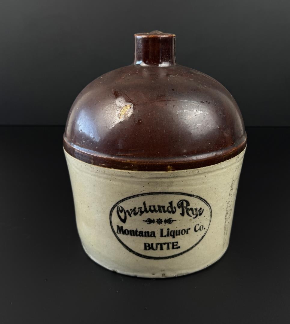 Overland Rye Montana Liquor Co Butte Jug: Made by Red Wing. 9 1/4" tall, 8" diameter. Some damage present as shown.