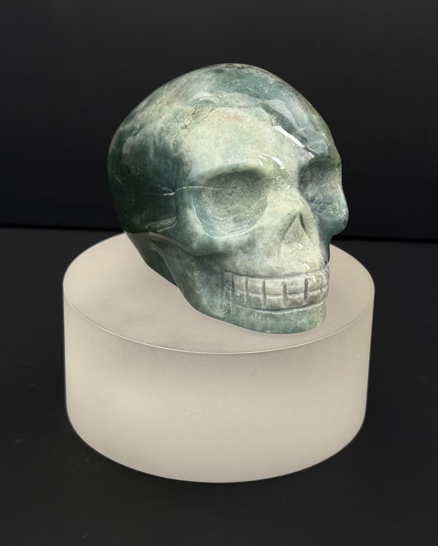 Green Zebra Agate Skull Carving: 3 1/4" by 2 3/8" by 2 1/8". 408.3 grams.