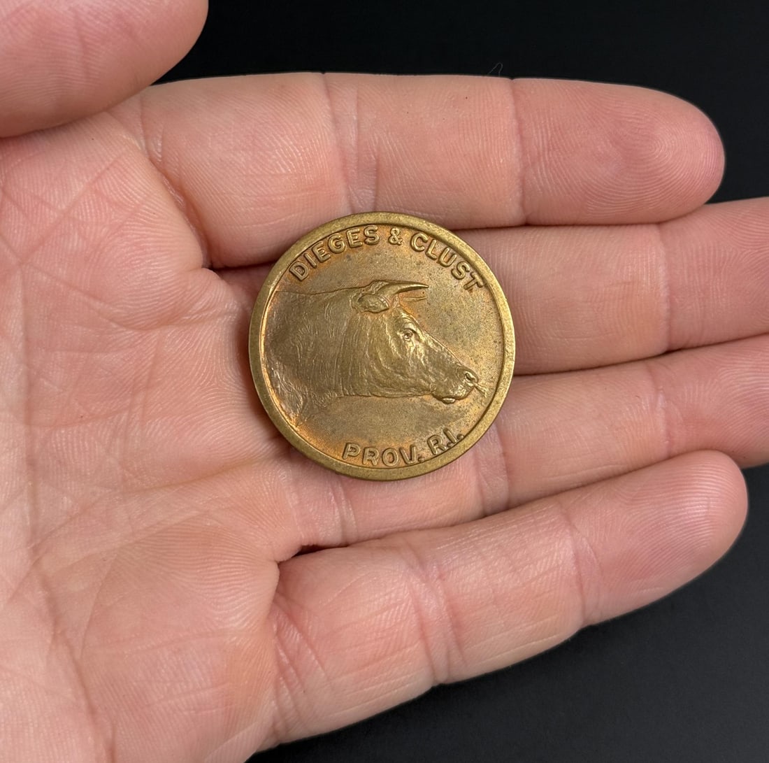Providence Rhode Island Flipper Token: Made by Dieges & Clust. One side illustrates a bull market and the other illustrates a bear market.