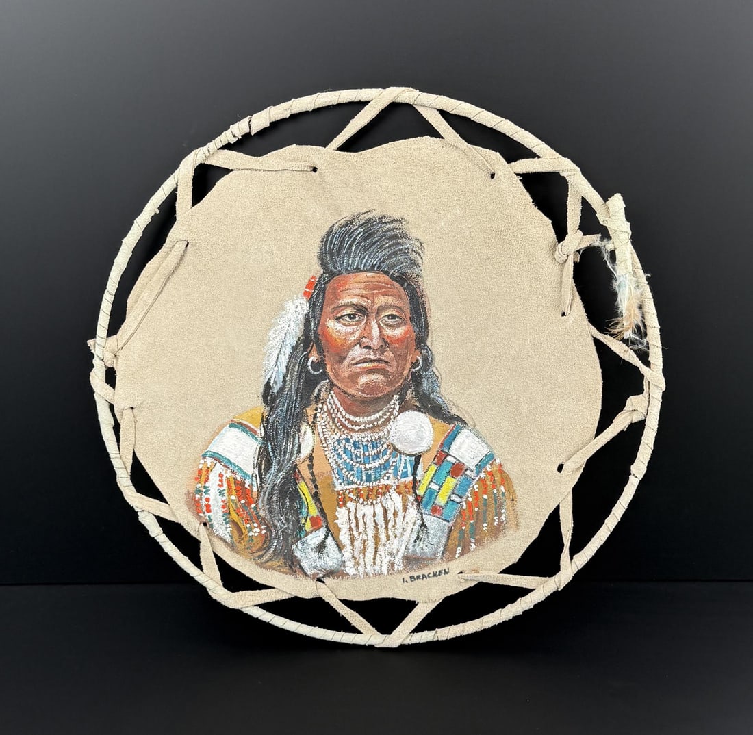Irma Bracken Chief Plenty Coups Painted Shield: Made by Irma Bracken in 1992. 14 1/4" diameter.