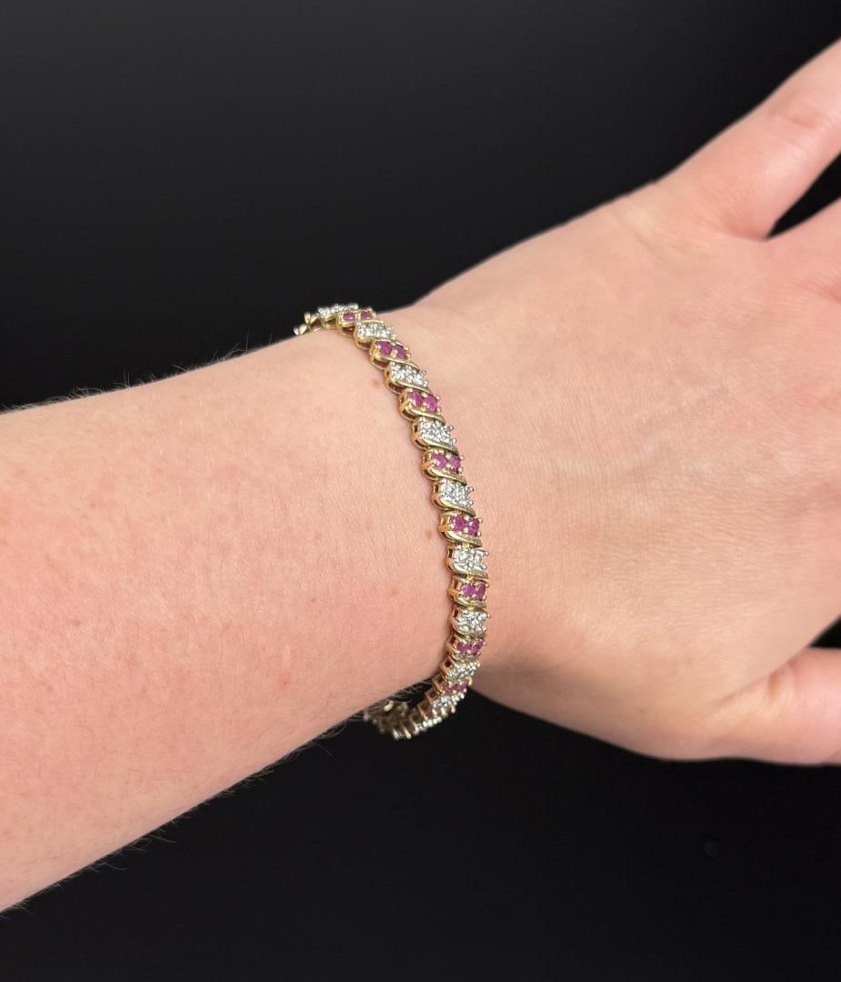 Sterling Silver Ruby Tennis Bracelet: 17.18 grams. 7 1/4" inner circumference.