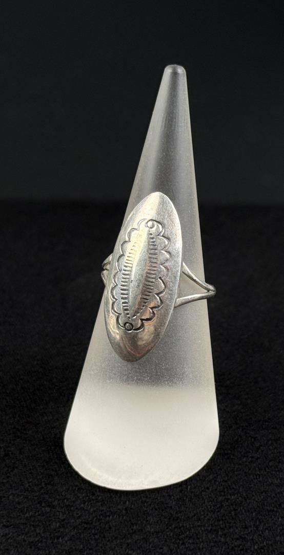 Navajo Sterling Silver Concho Pattern Ring: Signed as shown. Size 7 1/4. 3.69 grams.