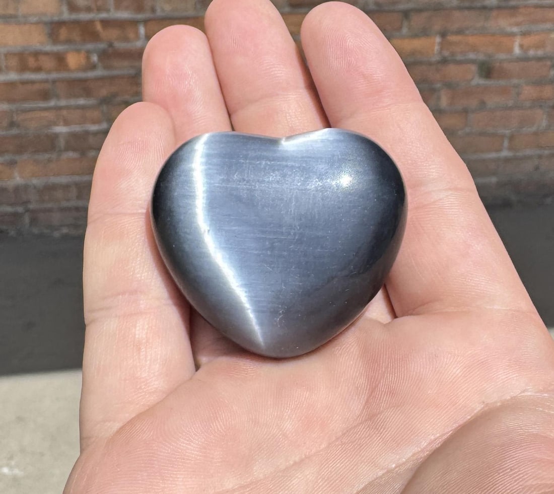 Grey Tigers Eye Carved Heart: 74.33 grams. 1 3/8" by 1 5/8".
