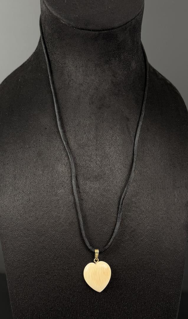 Alaskan Inuit Eskimo Ivory Heart Necklace: 13 7/8" long as displayed. This item cannot be shipped to Oregon, California, Hawaii, New York, New Jersey, Internationally, or any other state that prohibits.