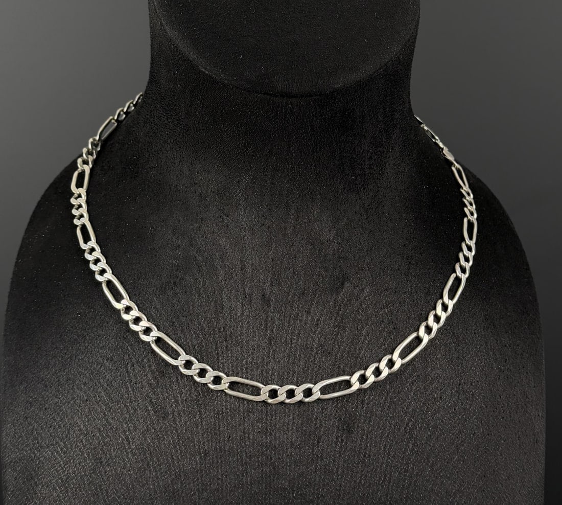 Large Sterling Silver Figaro Chain Necklace: 27.63 grams, 10" long as displayed.