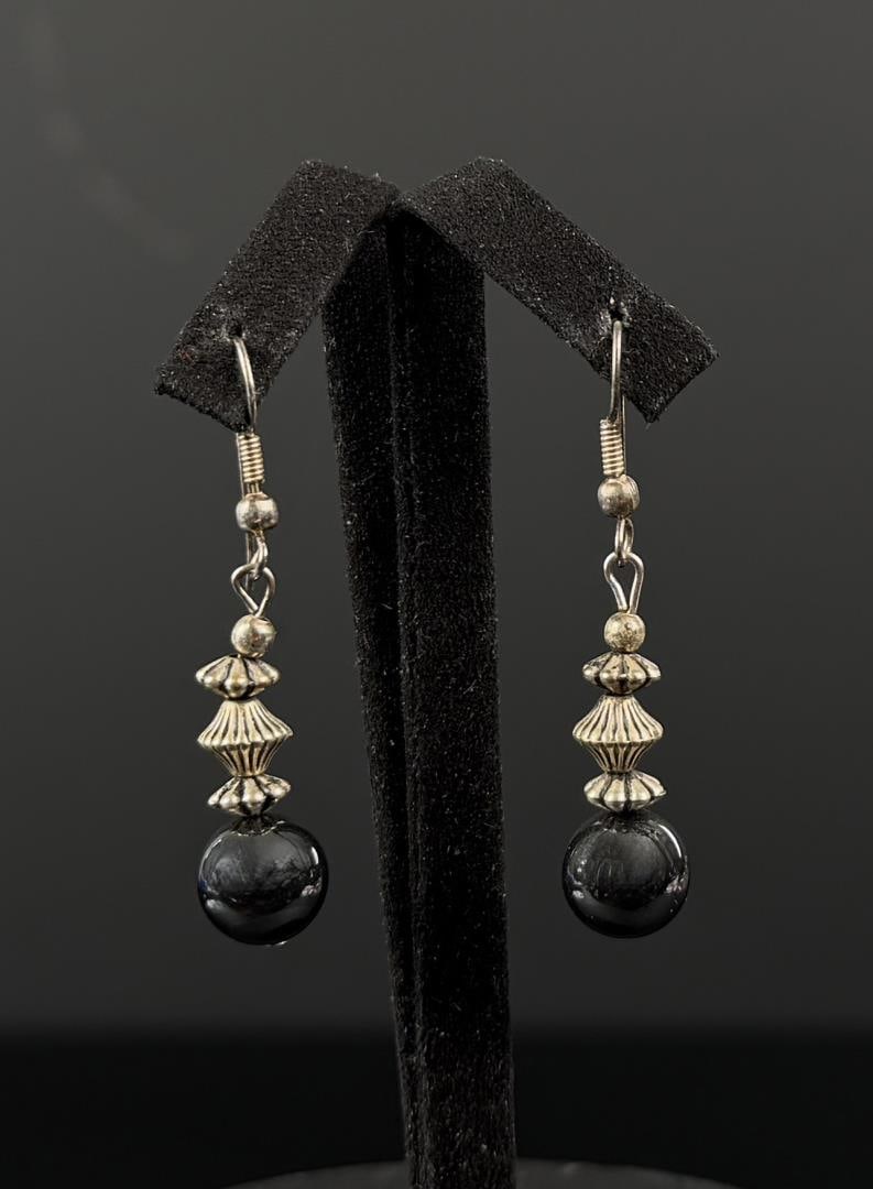 Navajo Sterling Silver Bench Bead Earrings: 1 1/4" by 1/4". 6.72 grams.