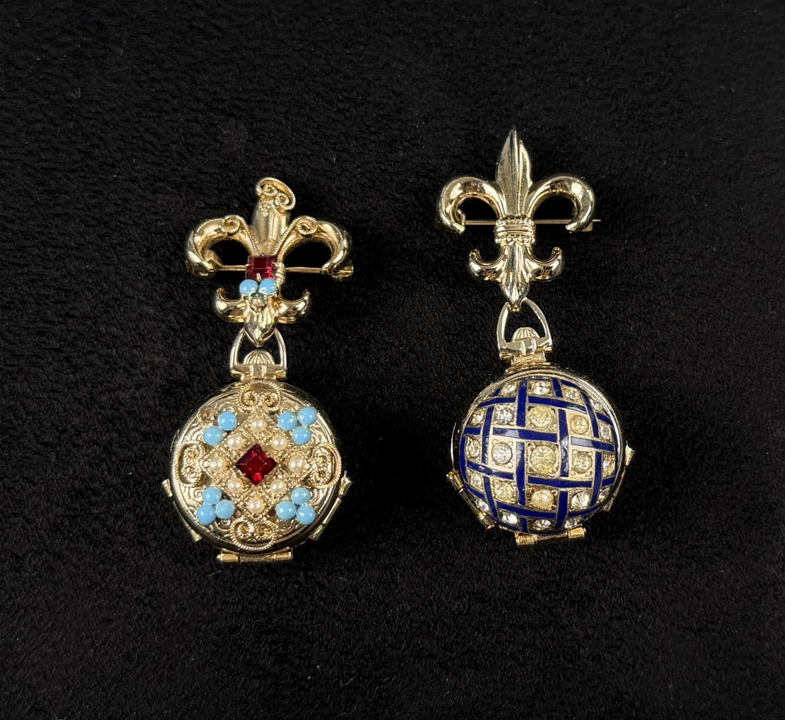 Coro Pegasus Fleur de Lis Locket Brooches: Group of two, 2 3/8" long.
