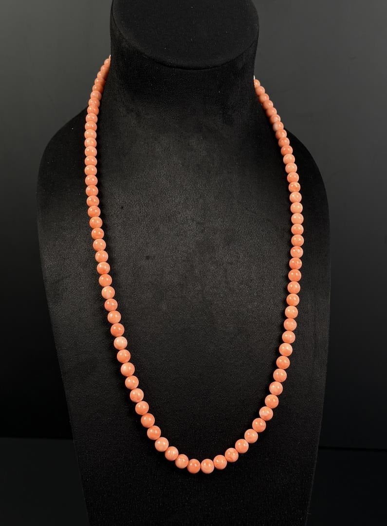 14K Gold Angle Skin Coral Bead Necklace: 14k gold clasp, 14 7/8" long.
