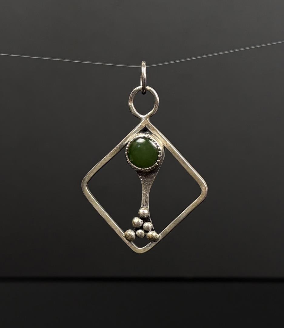 Sterling Silver Jade Pendant: 6.49 grams, 1 3/8" by 1 3/8".