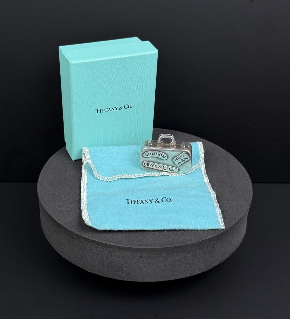 Tiffany & Co Sterling World Travler Suitcase: 38.69 grams, 1 1/4" by 1 3/4". In original box.