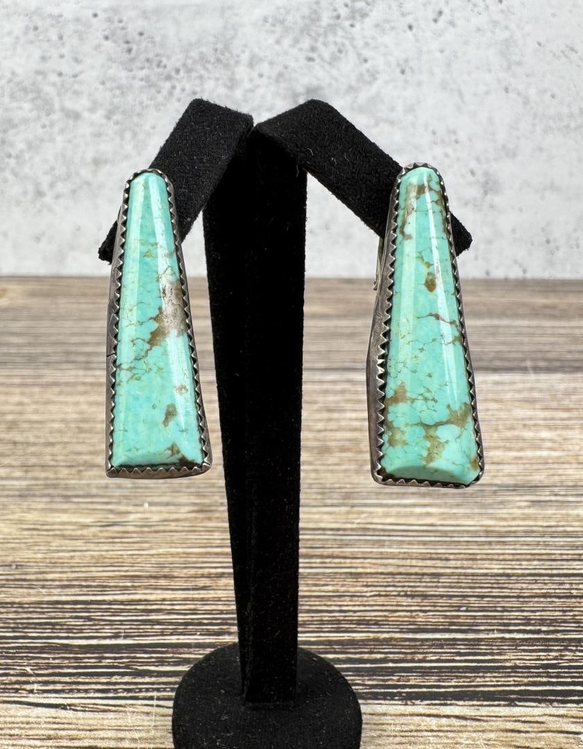 Navajo Sterling Silver Turquoise Earrings: Buffalo stamp signature. 8.4 grams, 1 3/8" long.
