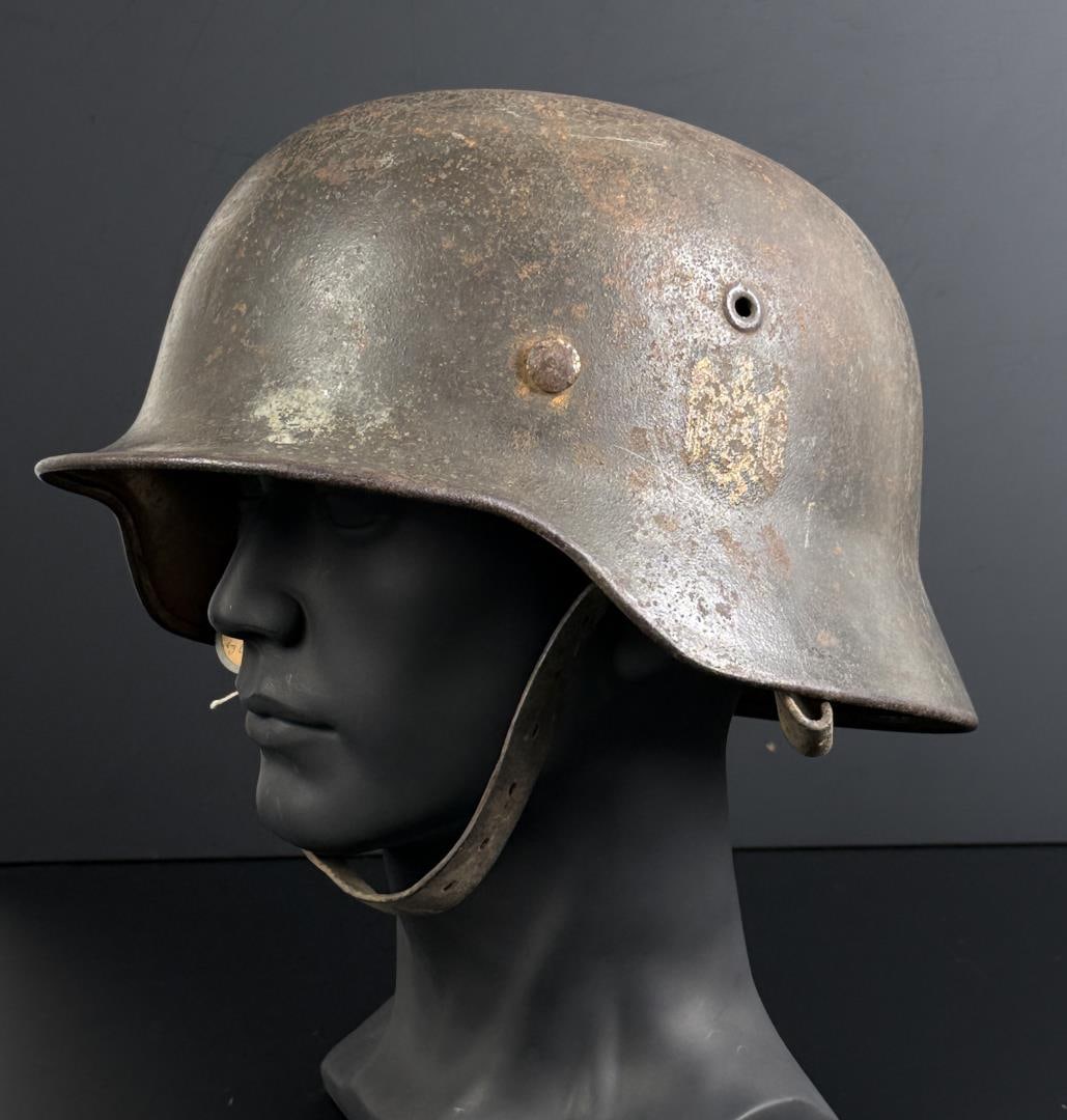 WW2 M40 Battle of Normandy Named German SS Helmet: Named to a soldier named Kralchinski. Tag states it was captured by Colonel Wilbur on the Duclair Battlefield, from an SS Troop. The tag refers to the seminal battle of the Hohenstaufen, 9th SS