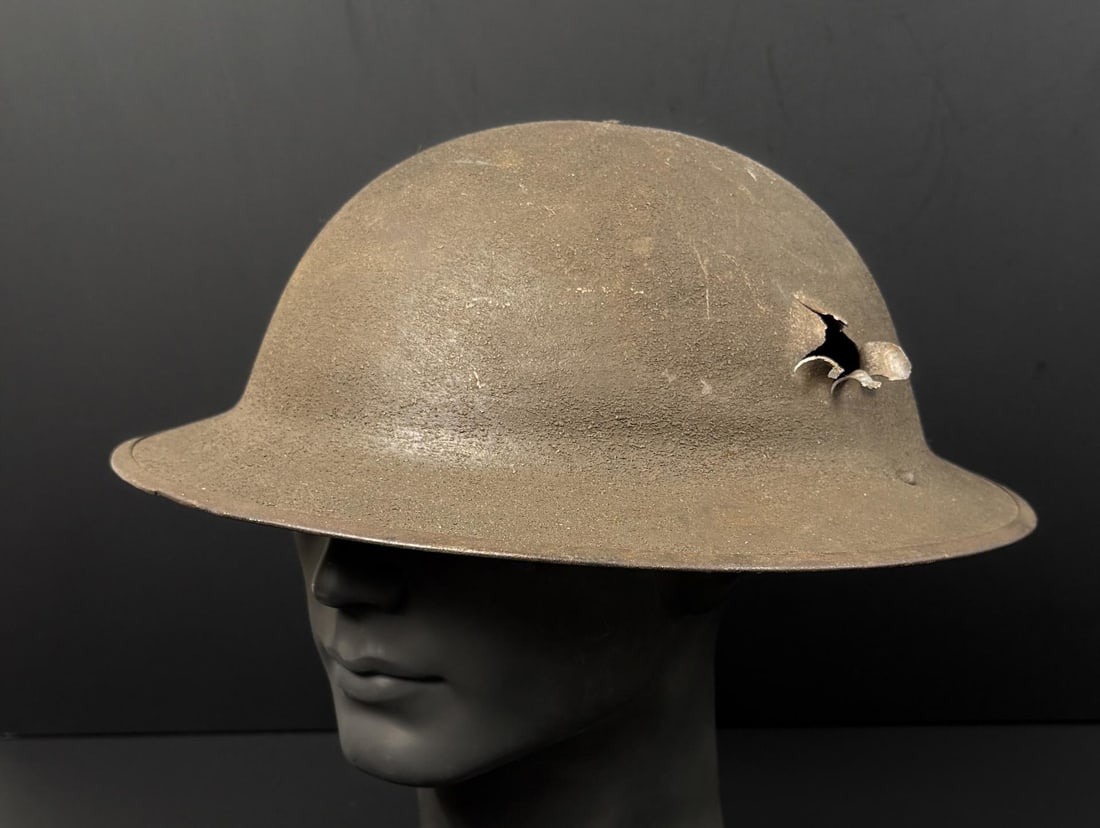 WWI WW1 Bullet Shrapnel Impact KIA Doughboy Helmet: No lining, this soldier would not have survived, the impact is through and through.