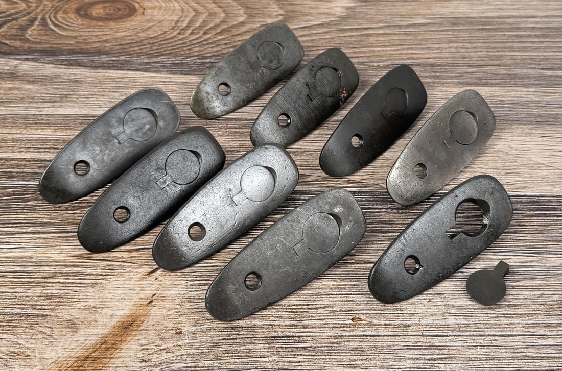 Springfield 1903 1903a3 Smooth Buttplates: 9 total. 3 are marked "R", the rest are unmarked.