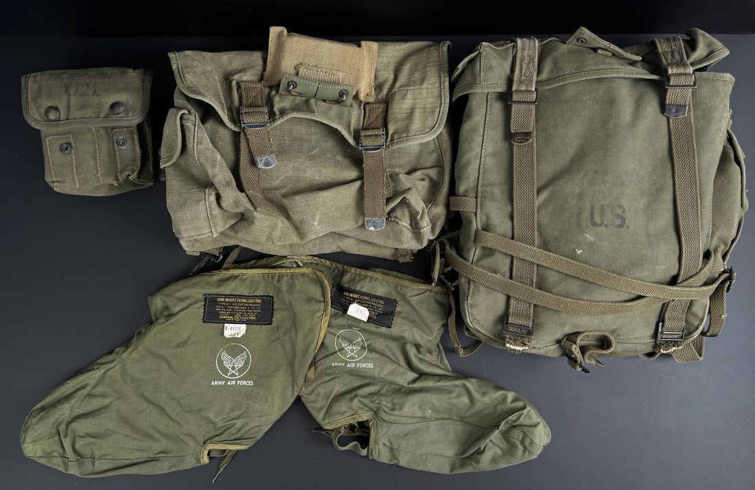 Collection of WW2 US Army Field Gear: Heated Flight Boot liners, Jungle First Aid Kit Case, M1944 Combat Pack Upper and Lower.