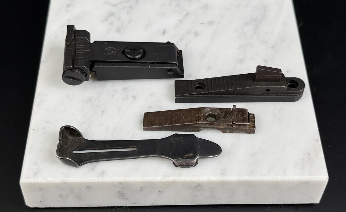 Collection of Front and Rear Rifle Sights: Thompson Contender, Remington, and Winchester.