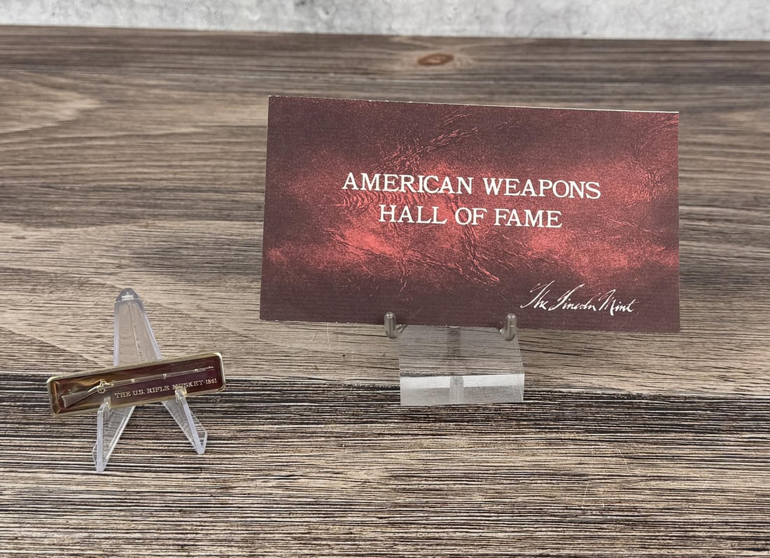 Lincoln Mint 1861 Musket 1oz Sterling Silver Bar: Issue No. 18 of the American Weapons Hall of Fame by the Lincoln Mint. The United States Rifle - Musket, Model of 1861. 31.23 grams of 24K Gold Plated Silver. Measures 2 3/8" by 5/8"