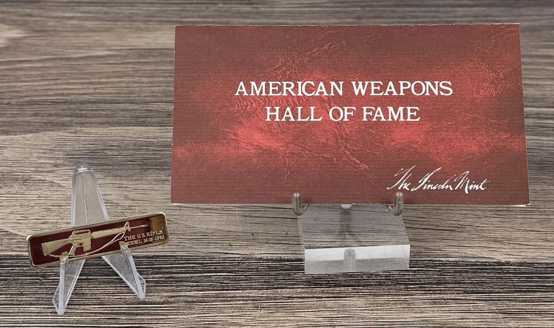 Lincoln Mint US M-16 Rifle 1oz Silver Bar: Issue No. 16 of the American Weapons Hall of Fame by the Lincoln Mint. The United States Automatic Rifle, Model M-16. 31.09 grams of 24K Gold Plated Silver. Measures 2 3/8" by 5/8"
