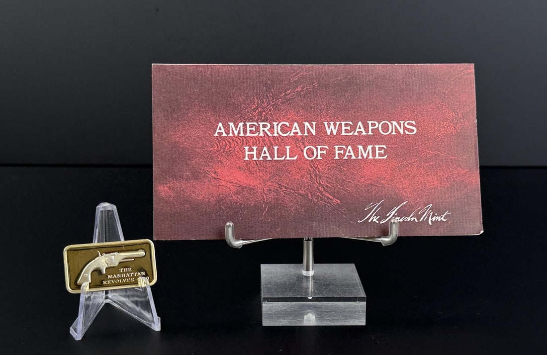 Lincoln Mint Manhattan Revolver 1oz Silver Bar: Issue No. 33 of the American Weapons Hall of Fame by the Lincoln Mint. The Manhattan No. 1 Cartridge Revolver, Model of 1860. 32.61 grams of 24K Gold Plated Silver. Measures 1 5/8" by 7/8"