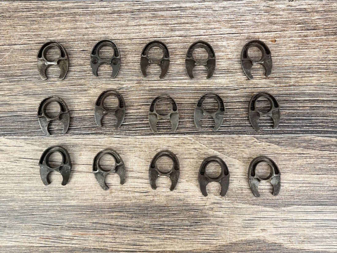 M1 Garand Milled Lower Handguard Bands: 15 total, 1 is damaged. 4 of the bands are stamped but illegible.
