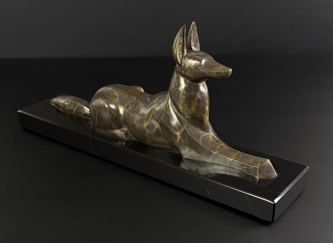 Mark Leichliter Anubis Bronze: Title is Anubis. 16" by 7" by 3 5/8". 2/20. Mark Leichliter. 20th century. Known for: Sculptor-abstract nature. A lifelong resident of Loveland, Colorado, he apprenticed with Dan Ostermiller and Kent