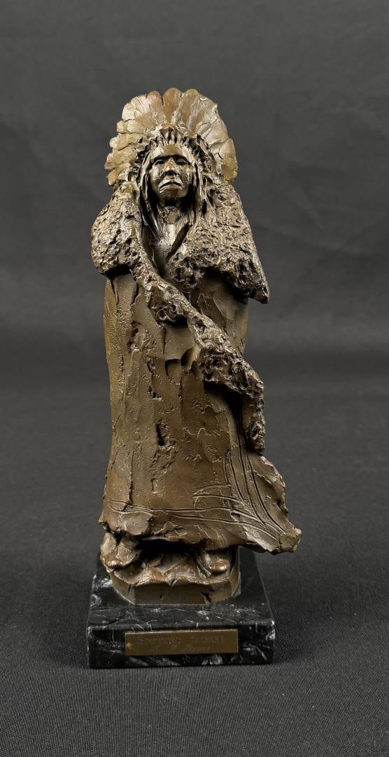 Richard Greeves Indian Chief Spotted Horse Bronze: Title is Spotted Horse. 9" by 3 1/2" by 3". Edition 27/50. Richard Vernon Greeves (Born 1935) is active/lives in Wyoming, Missouri. Richard Greeves is known for Indian figure sculpture. A sculptor of