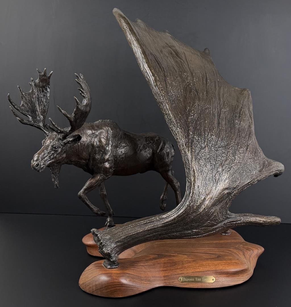 Anita Pauwels Before the Snow Moose Bronze: Title is Before the Snow. 16" by 19" by 23". 1/15. Anita Pauwels is a 20th/21st-century American artist known for her work in sculpture. She is specifically recognized for creating public art, such