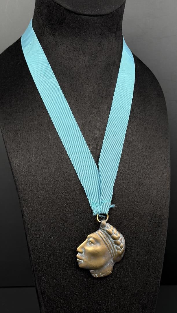 Shirley Smith 1991 Prix de West Bronze NAWA Medal: 16 1/4" long on ribbon. 1991 National Association of Western Art Award. Shirley Thomson Smith (Born 1929) is active/lives in Colorado, Oklahoma, Missouri. Shirley Smith is known for Sculptor-abstract 