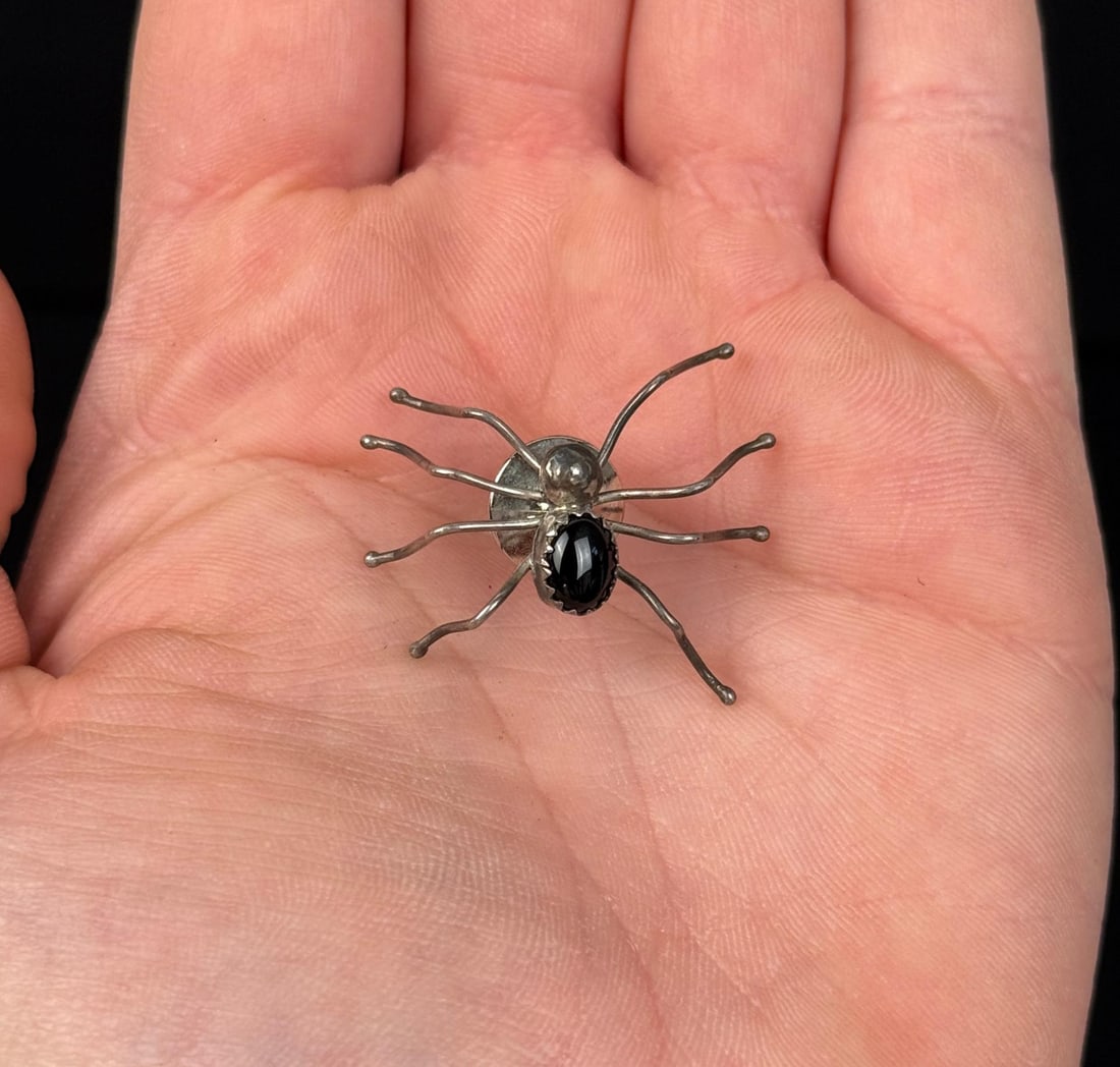 Navajo Sterling Silver Onyx Spider Brooch: 3/8" by 5/8". 2.84 grams.