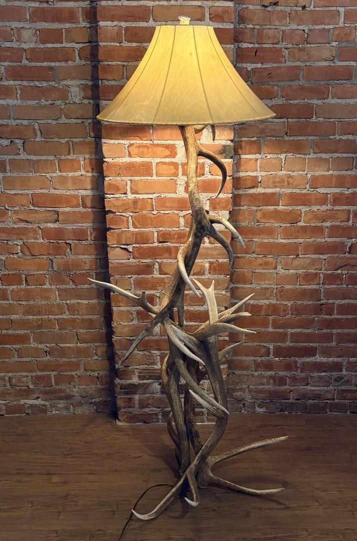 Montana Lodge Elk Antler Floor Lamp: 28" by 28" by 68". The lamp is in working condition. Provenance: Estate of John J. LoMonaco.