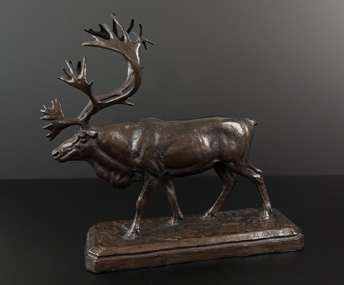 John Louis Clarke Woodland Caribou Bronze: Title is Woodland Caribou. 13 1/2" by 12 1/4" by 4 1/2". Provenance: Estate of John J. LoMonaco. John Louis (Cutapuis) Clarke (1881 - 1970) was active/lived in Montana, Wisconsin. John Clarke is