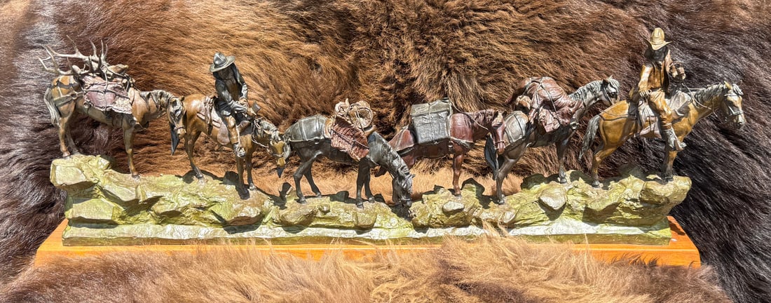 Earle Erik Heikka Trophy Hunters Bronze: Title is Trophy Hunters. 41" by 15" by 5". Edition 12 of 12. Earle Erik Heikka (1910 - 1941) was active/lived in Montana. Earle Heikka is known for Western genre sculpture, dioramas. In 1963 Joe De Yo