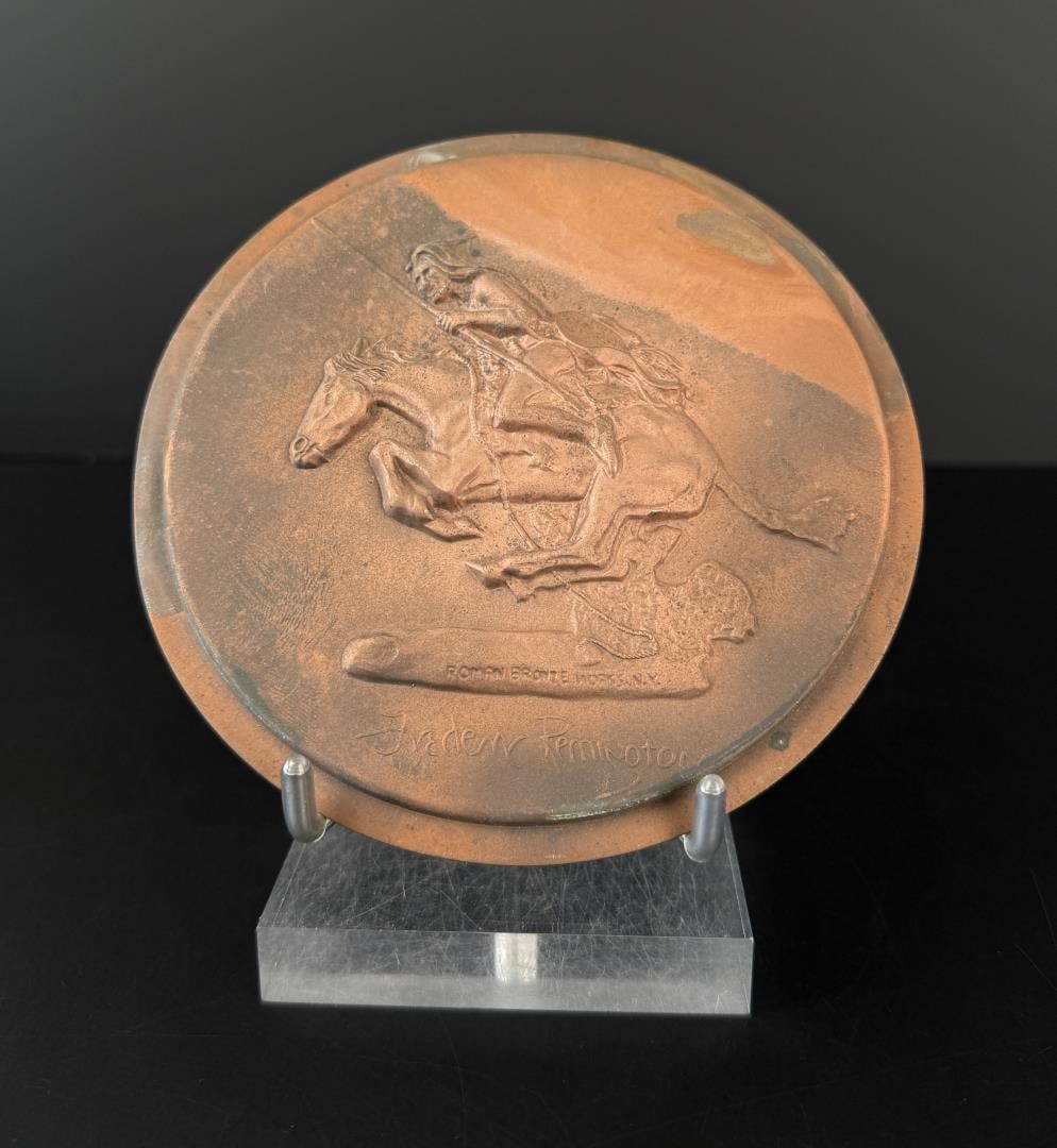 The Cheyenne Roman Bronze Works Remington Plaque: 5 1/2" in diameter. Cast by Roman Bronze Works in NY after Frederic Remington's original 1901 sculpture The Cheyenne. Frederic Sackrider Remington (1861 - 1909) was active/lived in New York, Kansas, C