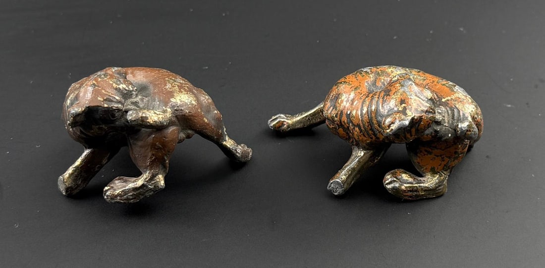 Newbro Drug Butte Montana Dog Paperweights: Both have leg damage. 2 3/4" by 1 5/8" by 1 1/4"