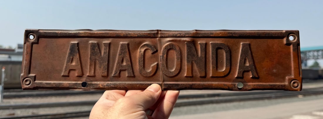 Anaconda Montana License Plate Topper Sign: 3 1/4" by 14 1/4". Also used on early car radiators.