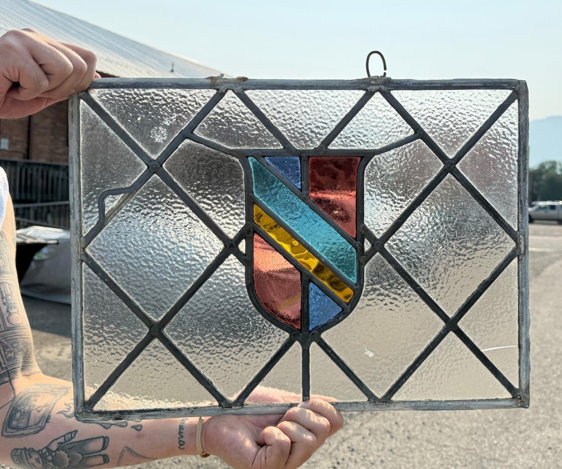 Antique Butte Montana Stained Glass Window: 14 1/2" by 20". Cracks and damage to frame as shown.