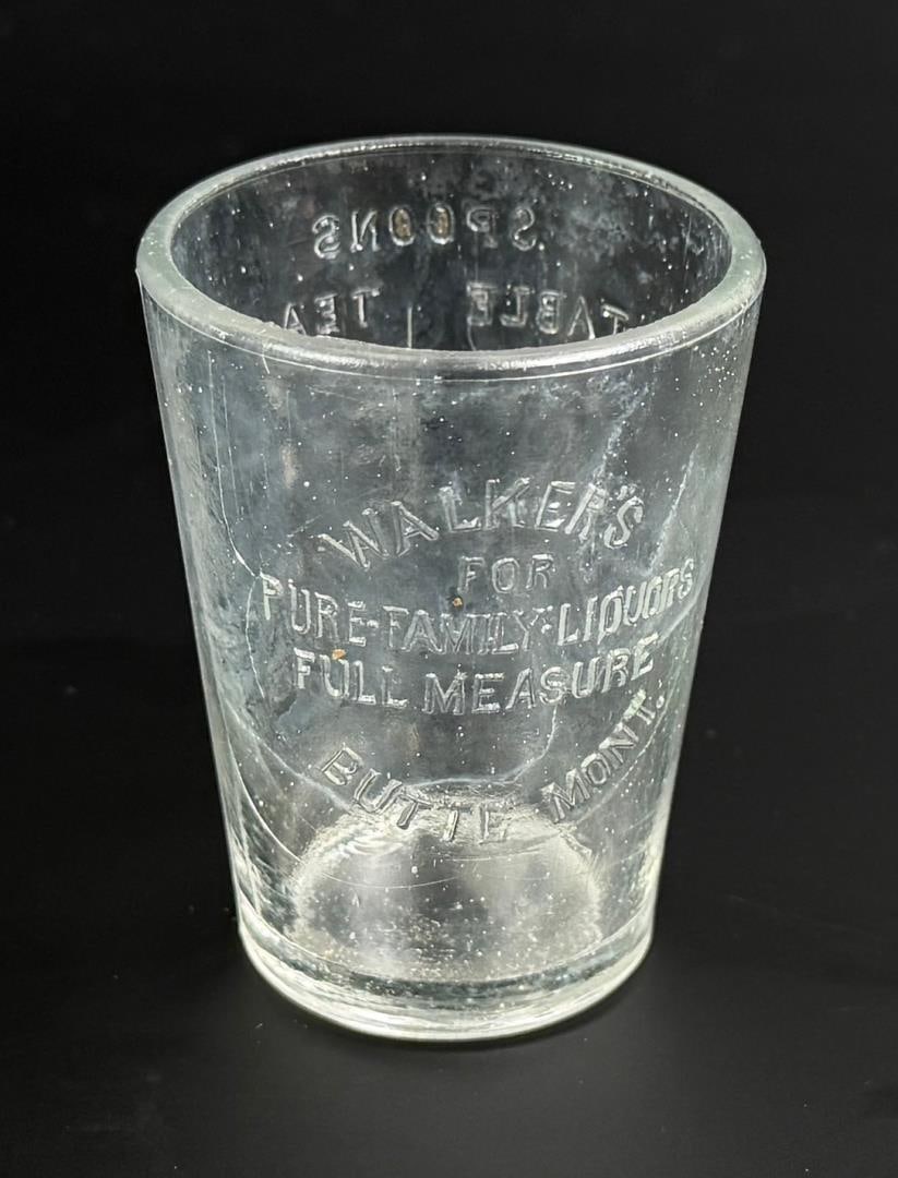 Butte Montana Walkers Family Liquors Shot Glass: 1 3/4" diameter by 2 1/4" tall. Nice piece of Montana advertising.