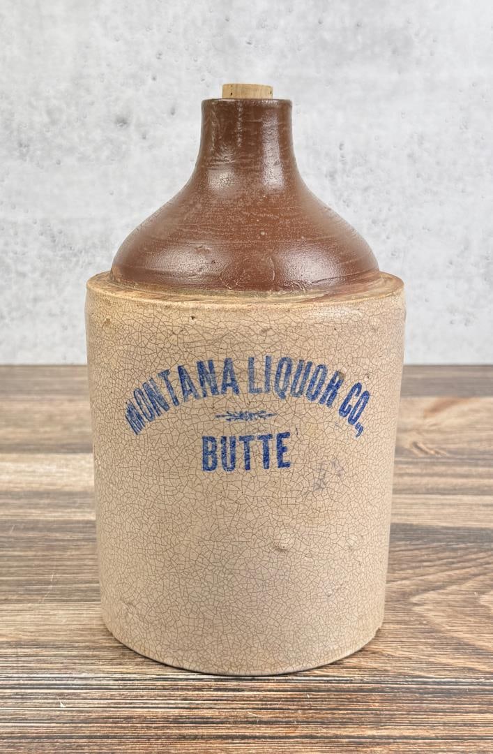Montana Liquor Company Stoneware Whiskey Jug: This jug is being sold as-is. It exhibits acid damage, and the authenticity is questionable. Stoneware jug from prominent historic Montana Liquor Company in Butte Montana founded by Henry Frank who wa
