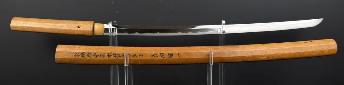 Sanjo Munechika Japanese Samurai Sword: 29 1/4" long with handle. Writing translates as follows: Side A: Keijo-fu, Jung-gu, Suhyo-cho, 853, Yoshida Yuichi Side B: Munechika. Shortened and unsigned. A Heian-period work. Length: 1 shaku 7 sun