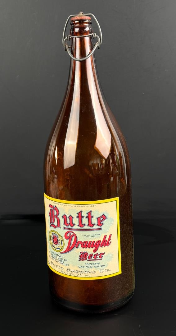 Butte Montana Draught Beer Half Gallon Bottle: 4 3/8" wide by 14" tall. Nice clean label. Swing top.