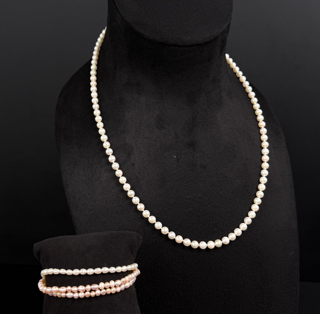 14k Gold Pearl Necklace and Bracelet: 37.31 grams. 14k gold clasp. Necklace is 10 7/8" long, and bracelet has an inner circumference of 7".
