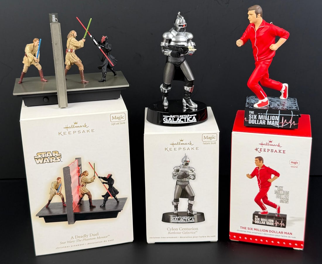 Hallmark Magic Keepsake Ornaments: Star Wars, Battlestar Galactica, Six Million Dollar Man.