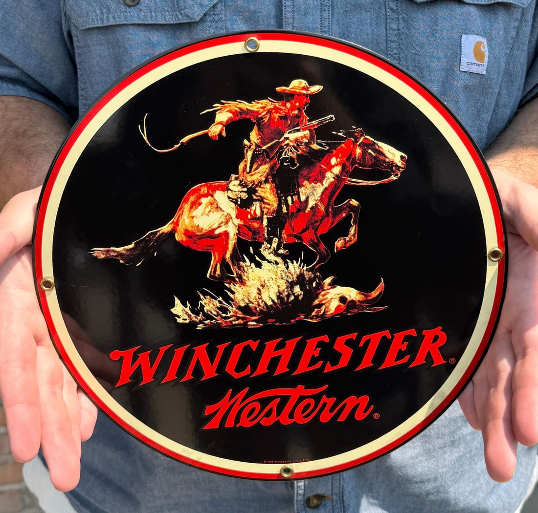 1993 Ande Rooney Winchester Western Porcelain Sign: 11" diameter.