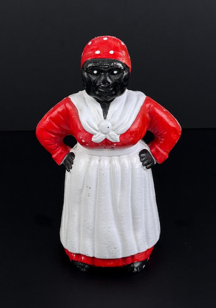Black Americana Cast Iron Mammy Coin Bank: 5" by 5" by 10 1/2". Reproduction