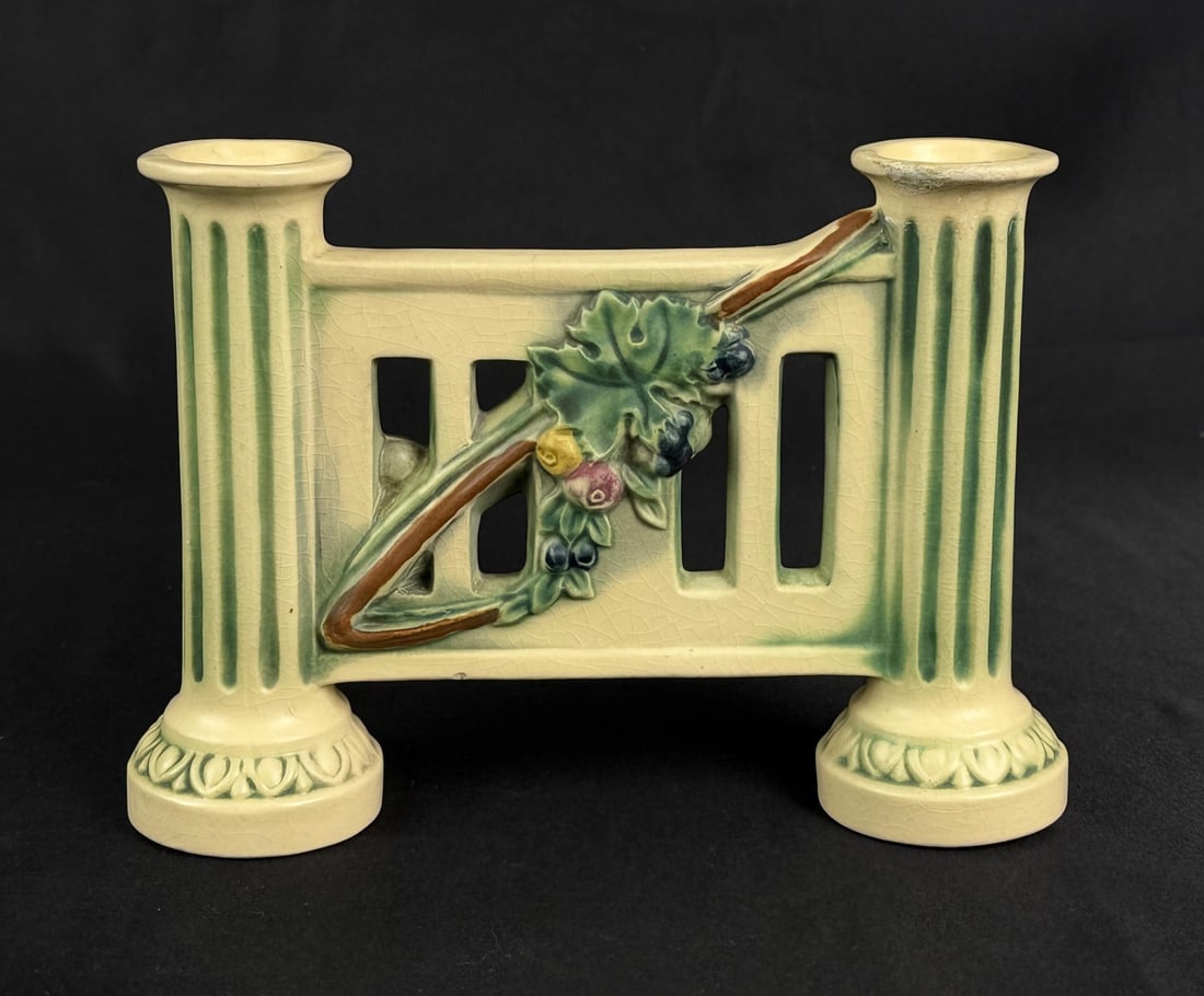 1923 Roseville Corinthian Double Candle Holder: 8 3/4" by 6 1/8" by 2 3/8". Chipped and repaired.