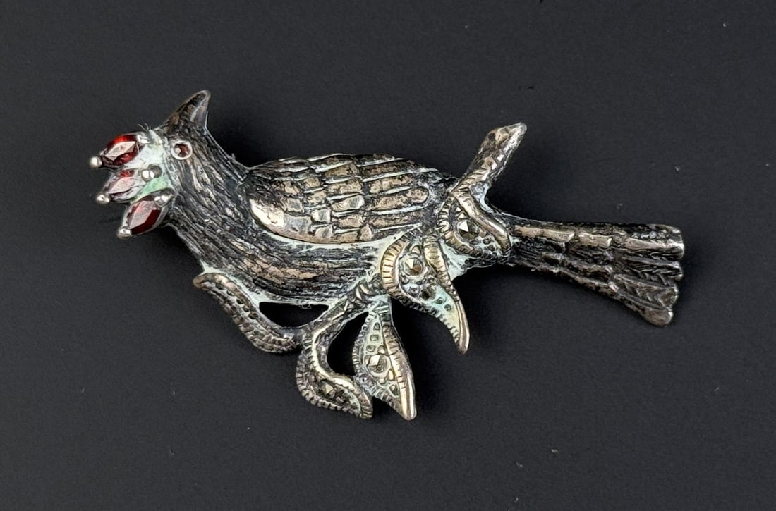 Sterling Silver Garnet Bird Brooch: 6.98 grams. 1 3/4" Long.