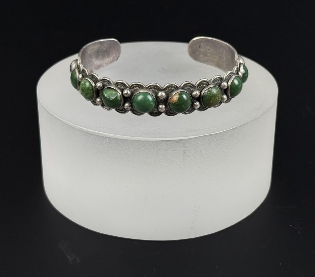 Fred Harvey Era Navajo Sterling Turquoise Bracelet: 6" inner circumference. One stone chipped. 23.37 grams.