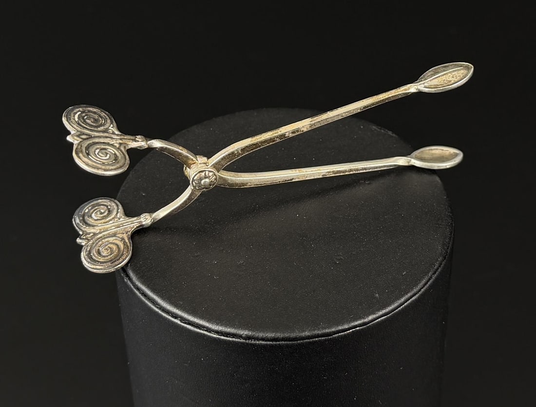 Danish Sterling Silver Sugar Tongs: 21.8 grams, 1 1/8" by 3 7/8" long.