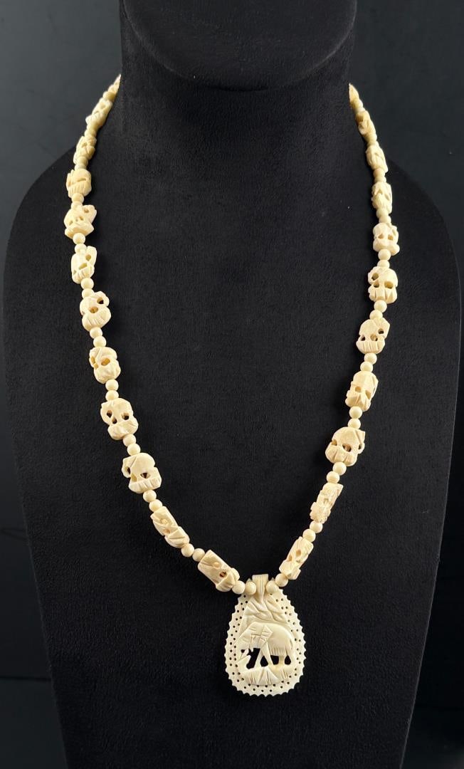 Carved Bone Elephant Necklace: 15" long as displayed